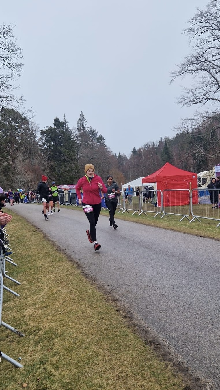 Maria running at a charity race event